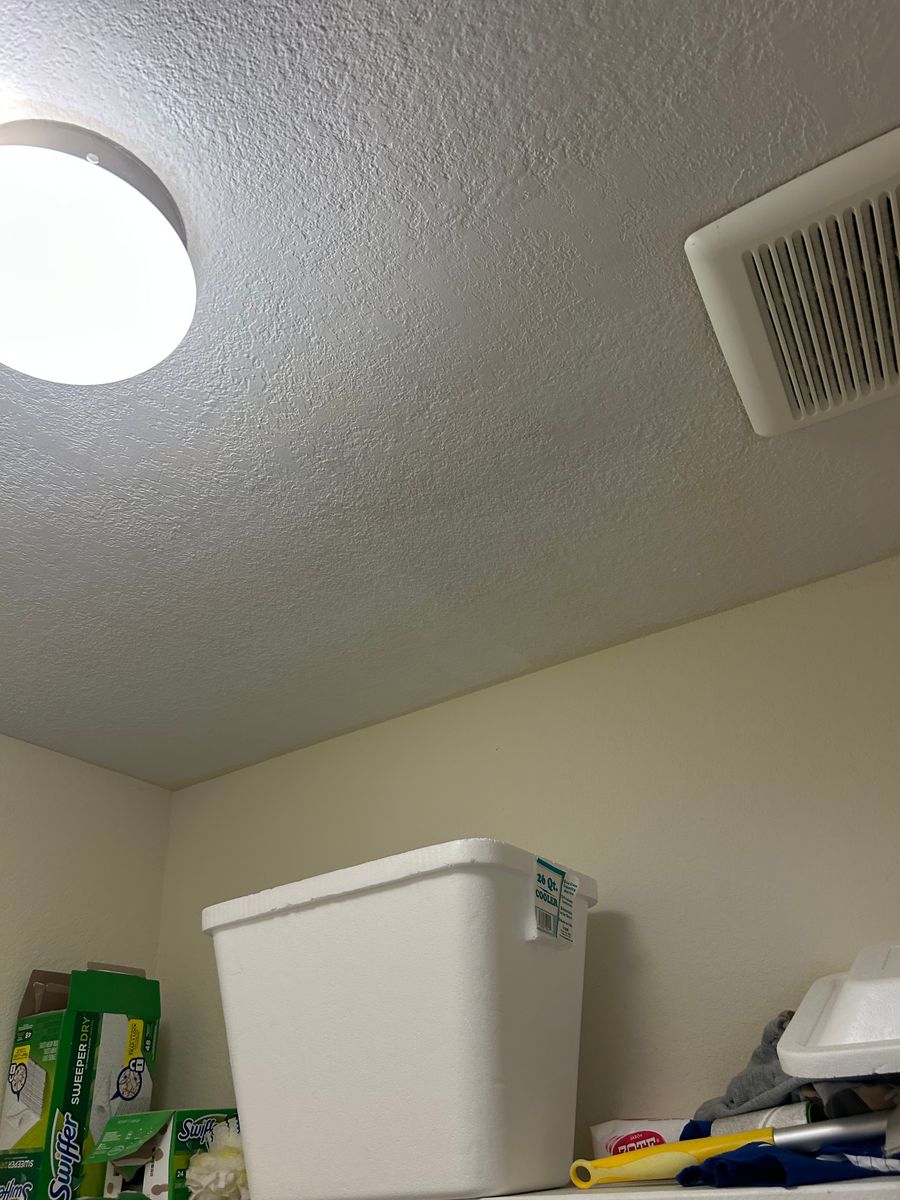 After: the same ceiling repaired and repainted, with no stain left