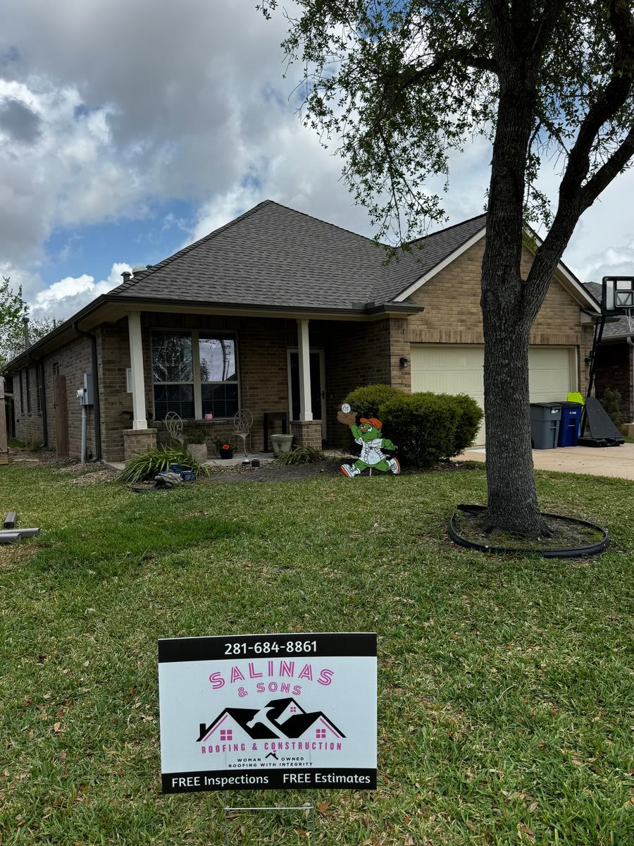 Brick home with a newly installed architectural shingle roof