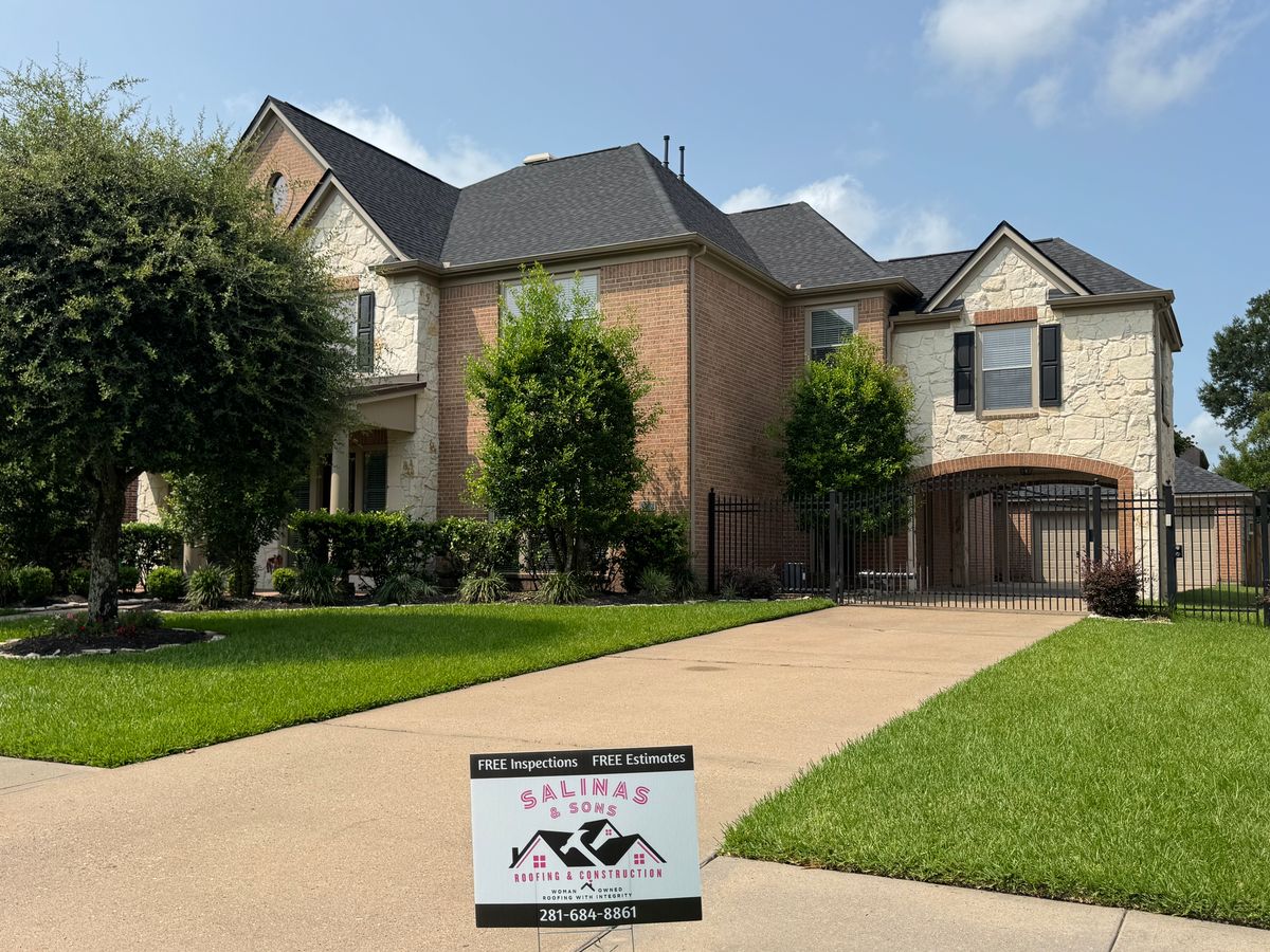 After: same Friendswood home with a new Rustic Black TAMKO Heritage roof