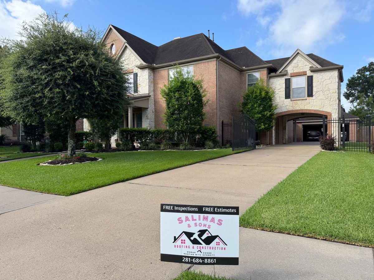 Before: two-story brick and stone home in Friendswood with its original roof