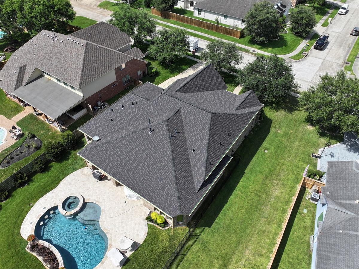 Aerial view of a home with a newly replaced roof